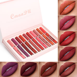 Set of lipsticks in a pink case with swatches of lipstick colors on a white background
