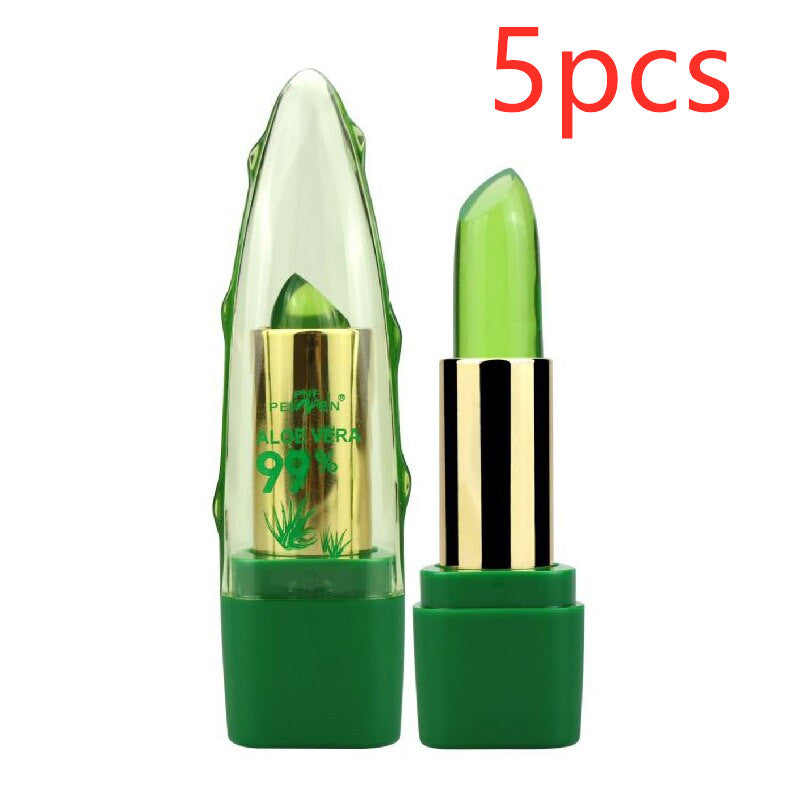 Green lip balm with gold cap and '99% Pure' text on a white background
