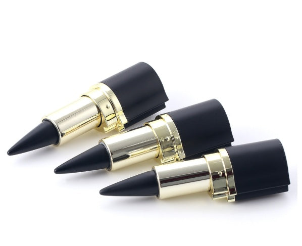 Three lipsticks with black tips and gold casings on a white background