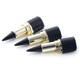 Three lipsticks with black tips and gold casings on a white background