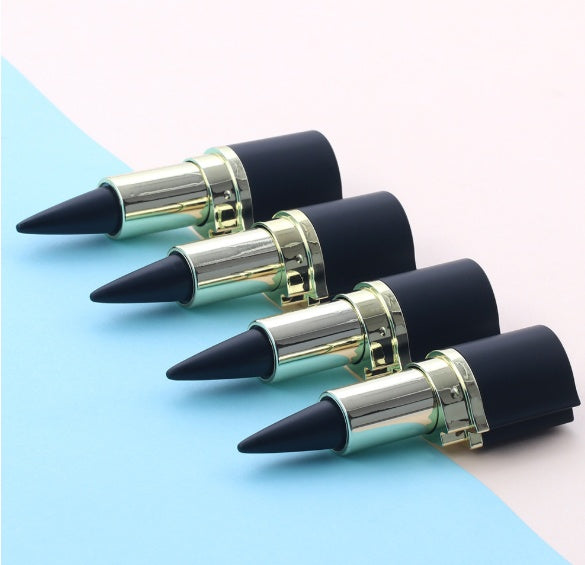 Four lipsticks with black tips and gold bases on a two-tone blue and white background