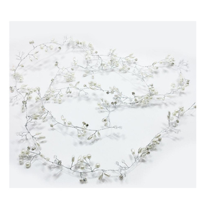 Floral vine with small white flowers on a light gray background