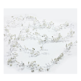 Floral vine with small white flowers on a light gray background
