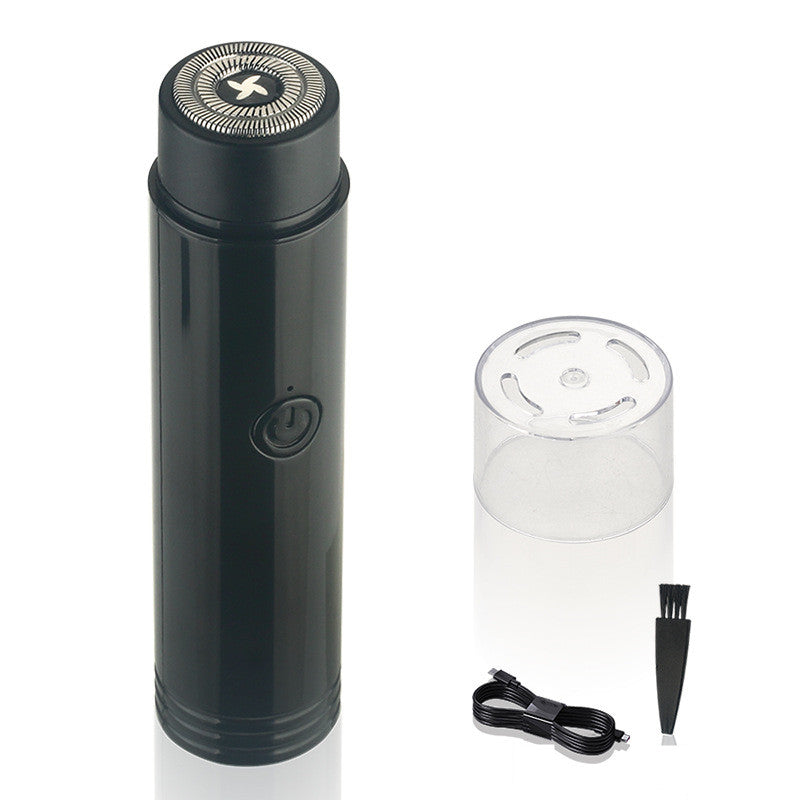 Black electric shaver with clear container and accessories on a white background