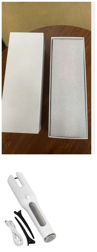 White electronic device with packaging and accessories on a white background