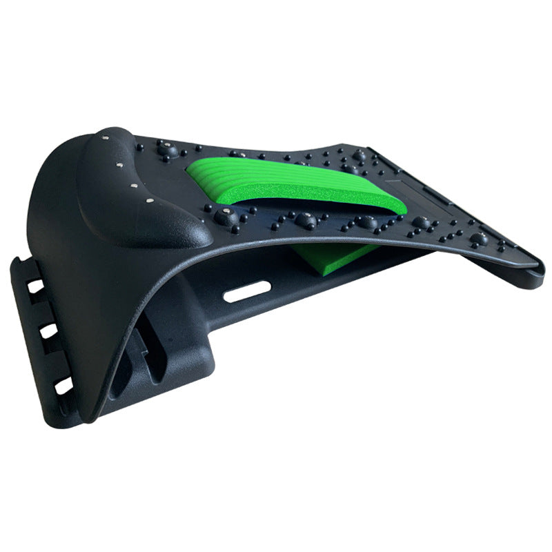Black and green plastic component on a white background