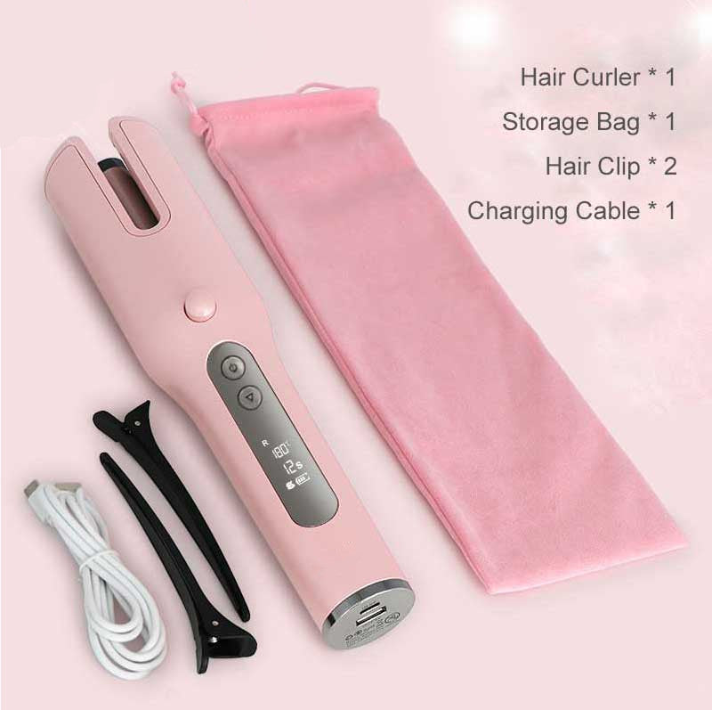 Pink hair curler with accessories on a light pink background