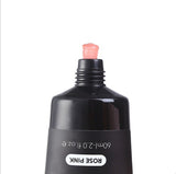 Black cosmetic bottle with a pink cap on a white background