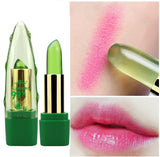 Green lipstick with gold accents, pink lipstick swatch, and close-up of lips wearing pink lipstick.