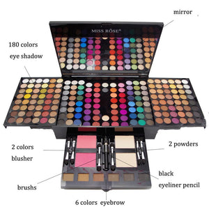 Makeup palette with various shades and brushes on a white background