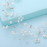Pearl and crystal hair vine on a light blue background