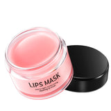 Lips mask in a pink jar with a black lid on a white background