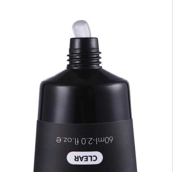 Black cosmetic bottle with dropper on a white background