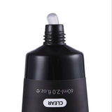 Black cosmetic bottle with dropper on a white background