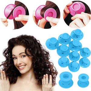Woman with styled hair and blue hair rollers on a white background