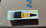 Lipstick packaging with floral design on a cardboard background