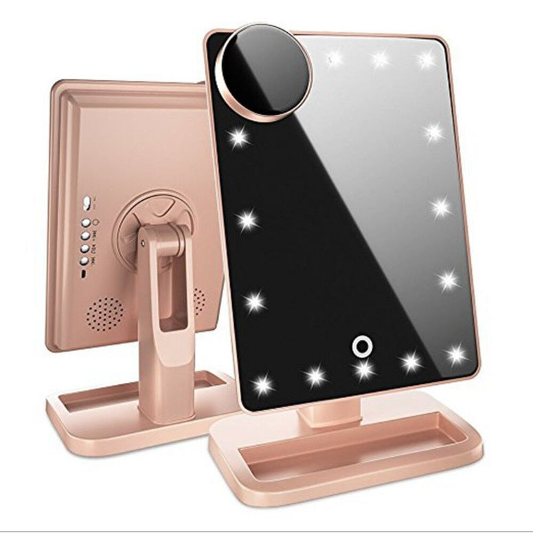 Makeup mirror with LED lights and rose gold frame on a white background