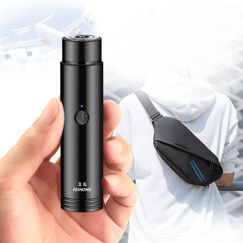 Black electronic device held in a hand with a blurred background