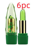 Green aloe vera lip balm with gold cap on a white background